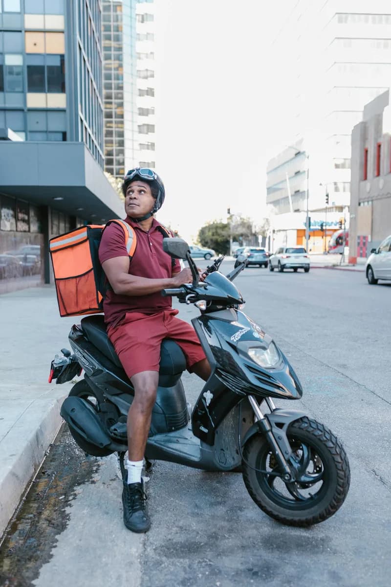 توصيل سريع — delivery rider on a motorcycle